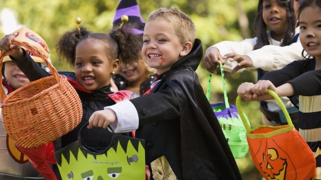 Children playing the "trick or treat"